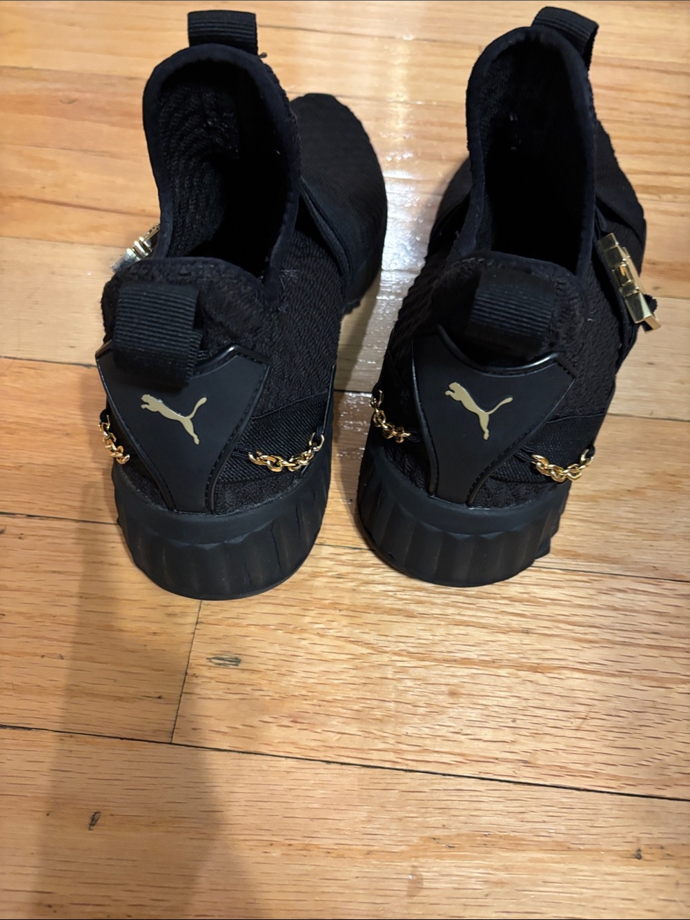 Puma Black Slip-On Knit Sneakers with Gold Hardware - Picture 2 of 5